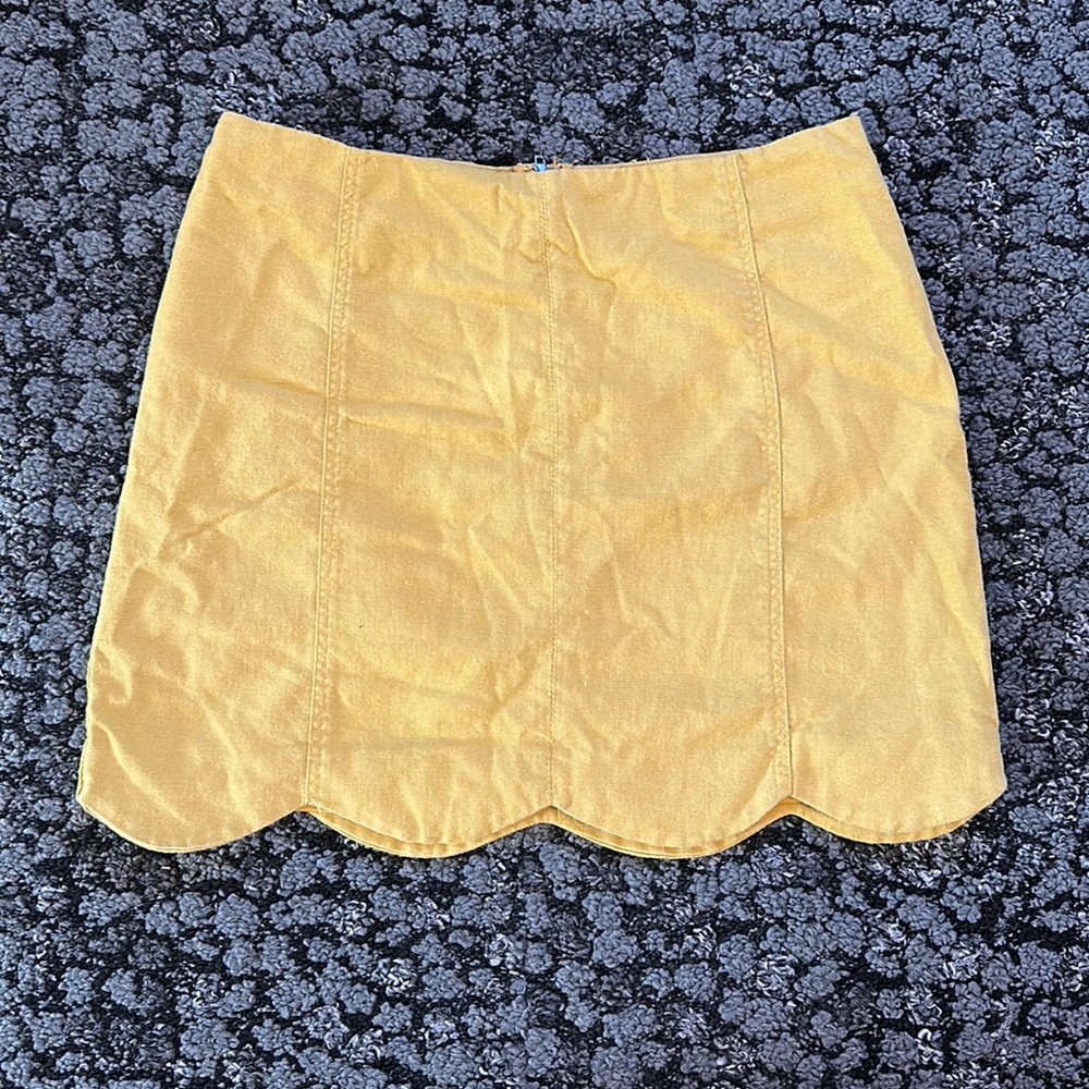 Yellow scalloped mini skirt
